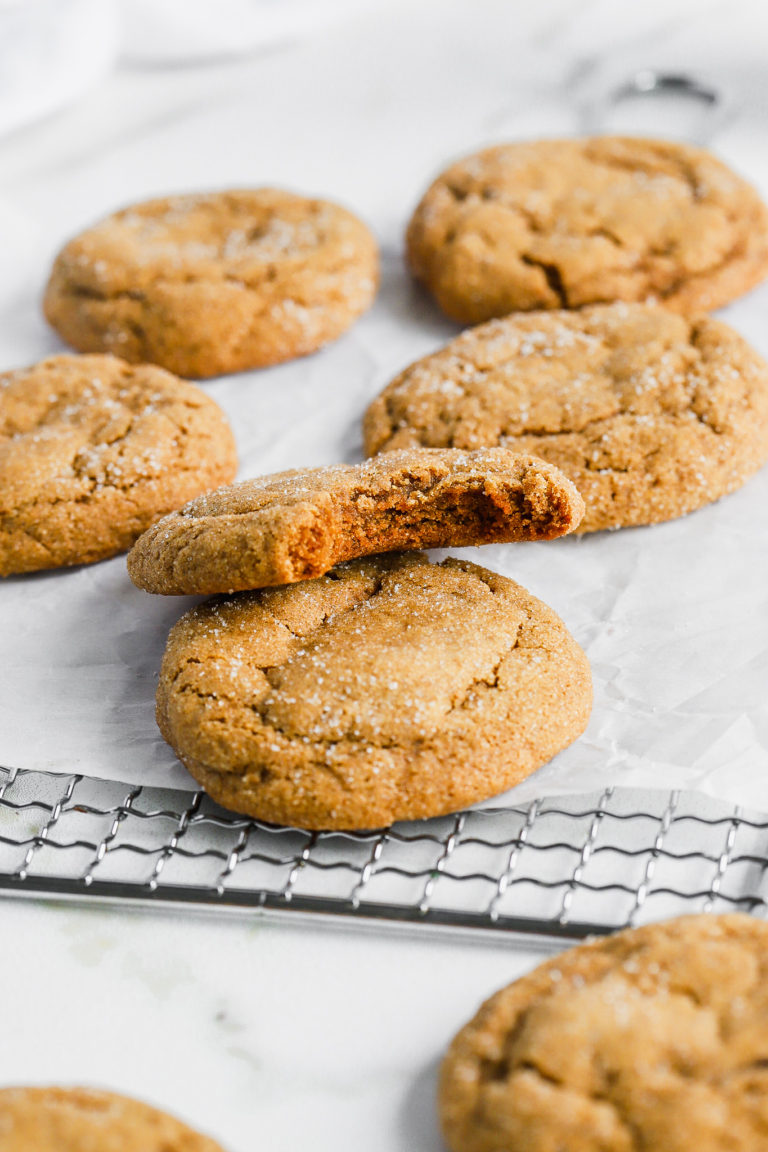 chewy ginger molasses cookies on parchment paper