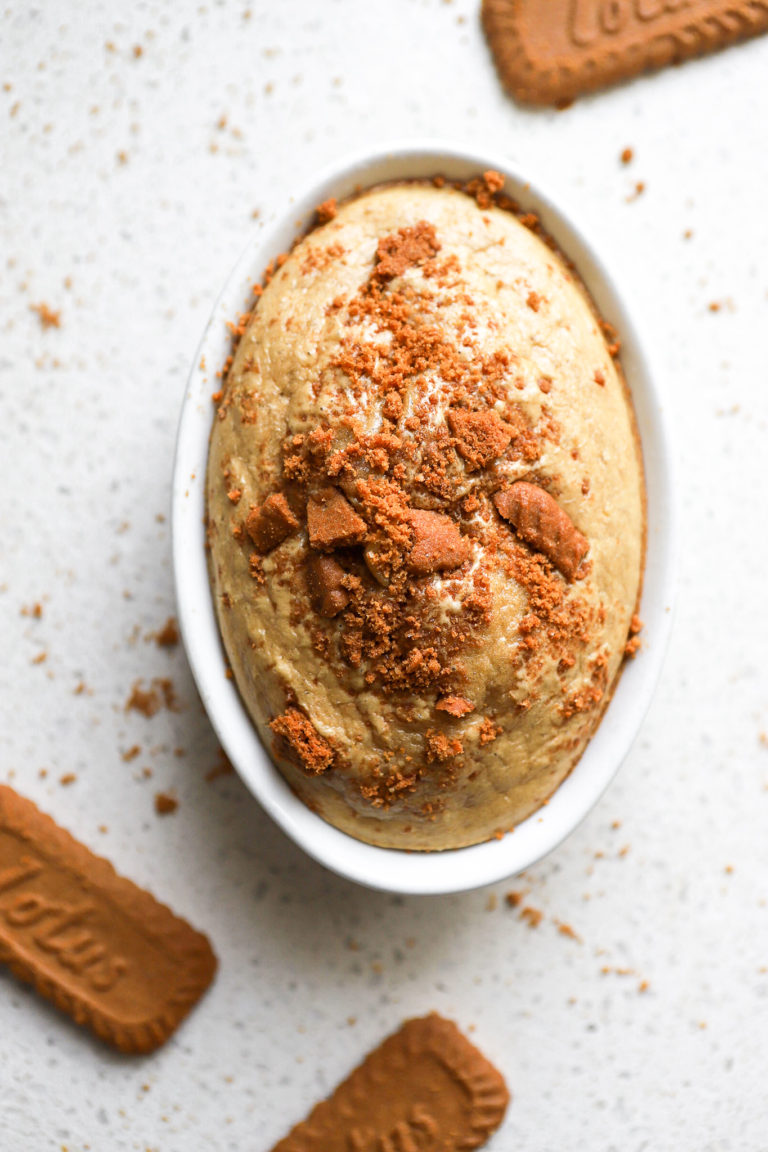 top down shot of biscoff baked oats with biscoff cookie crumbles