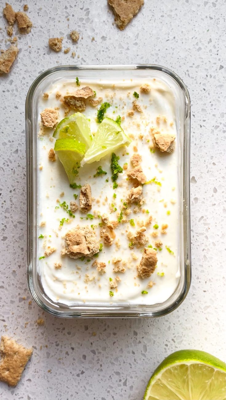 Top down view of high protein key lime pie overnight oats in glass container.
