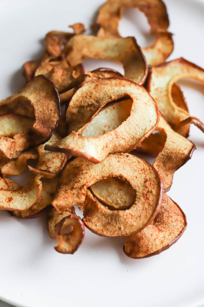 side shot of fried apple rings on a plate