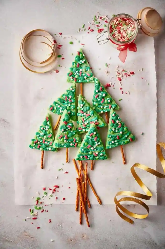 christmas tree sugar cookies with pretzels and green icing