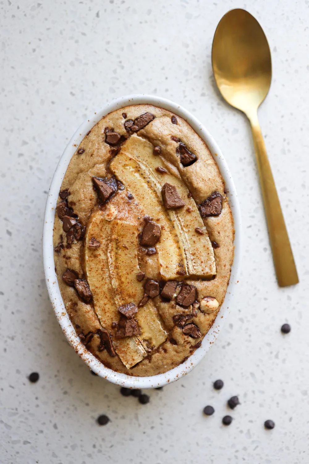 top down shot of banana bread baked oats recipe with 1 banana