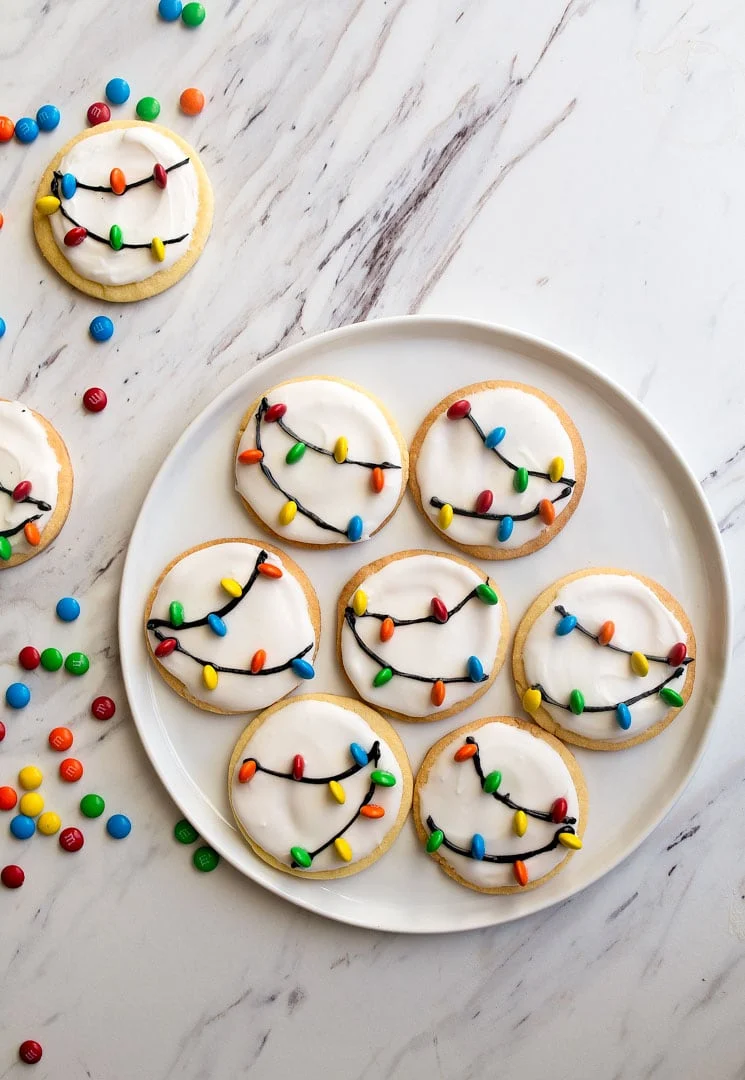 christmas lights cookies with white royal icing and m&m's