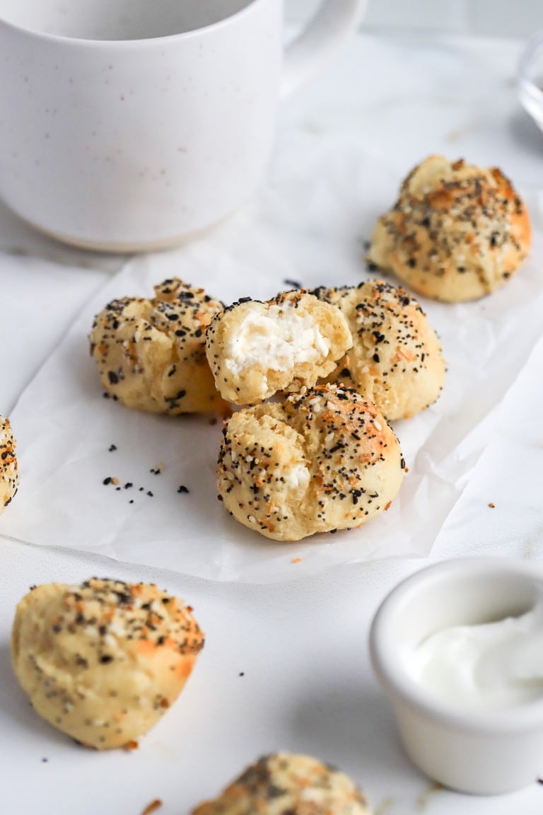 simple recipe of everything bagel bites with plain cheese cheese inside and cup of coffee in background