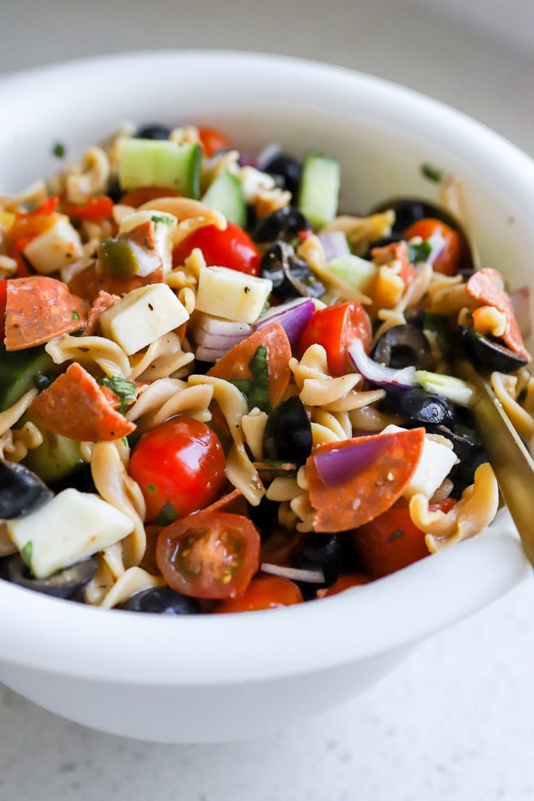 homemade zesty italian salad with chunks of mozzarella cheese