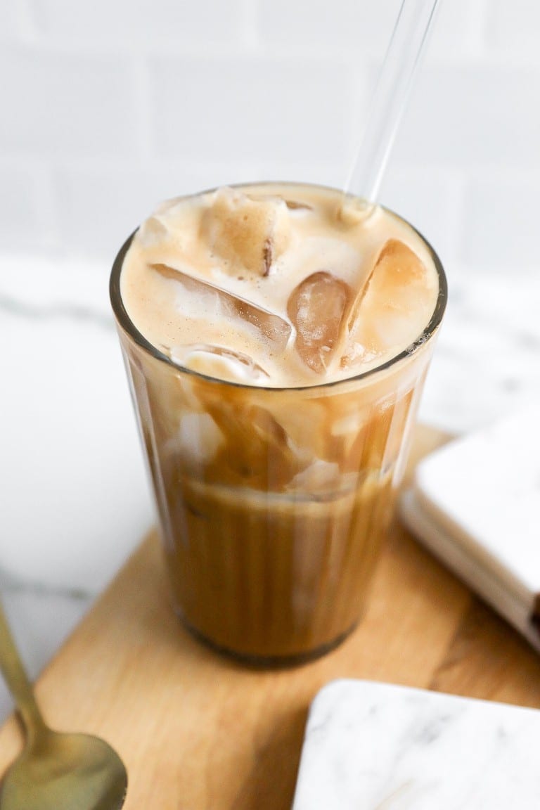 side view of iced latte with iced cibes