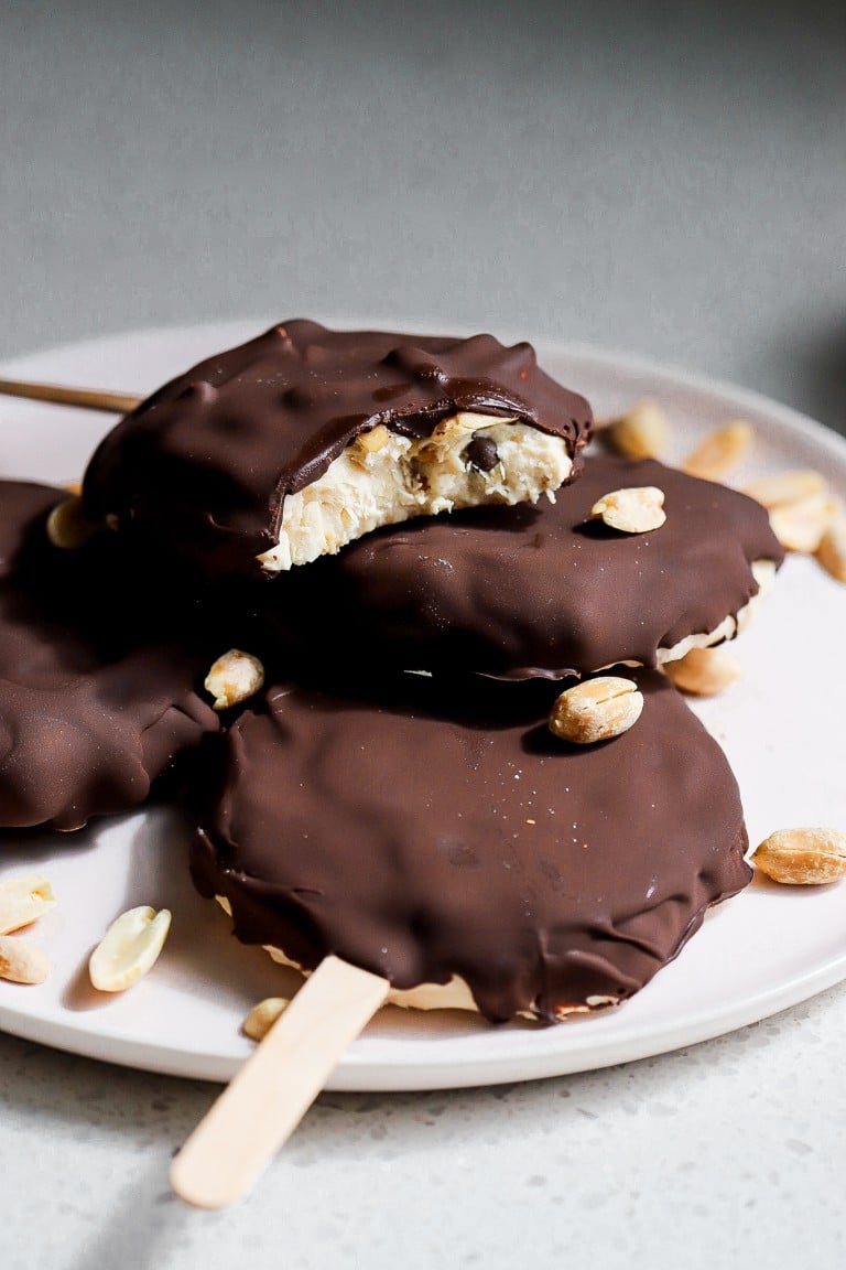 bite shot of peanut butter chip frozen yogurt bars stacked on each other