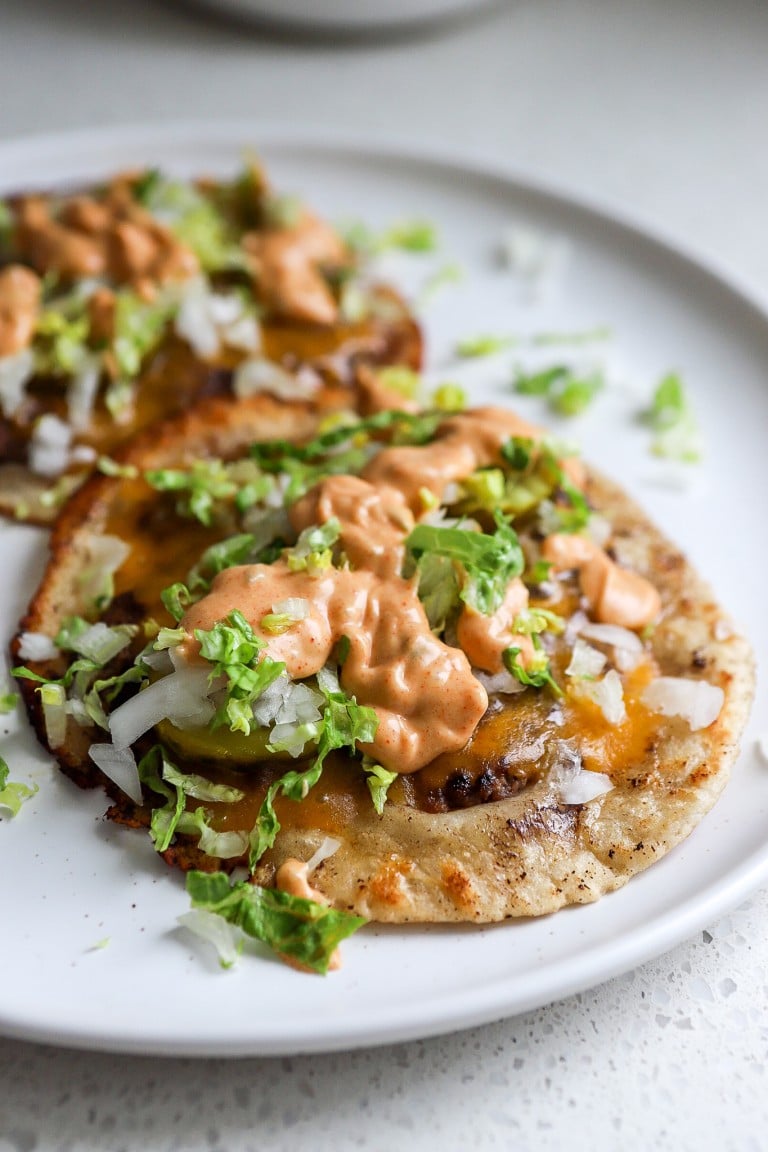 side view of smash burger tacos with homemade big mac sauce