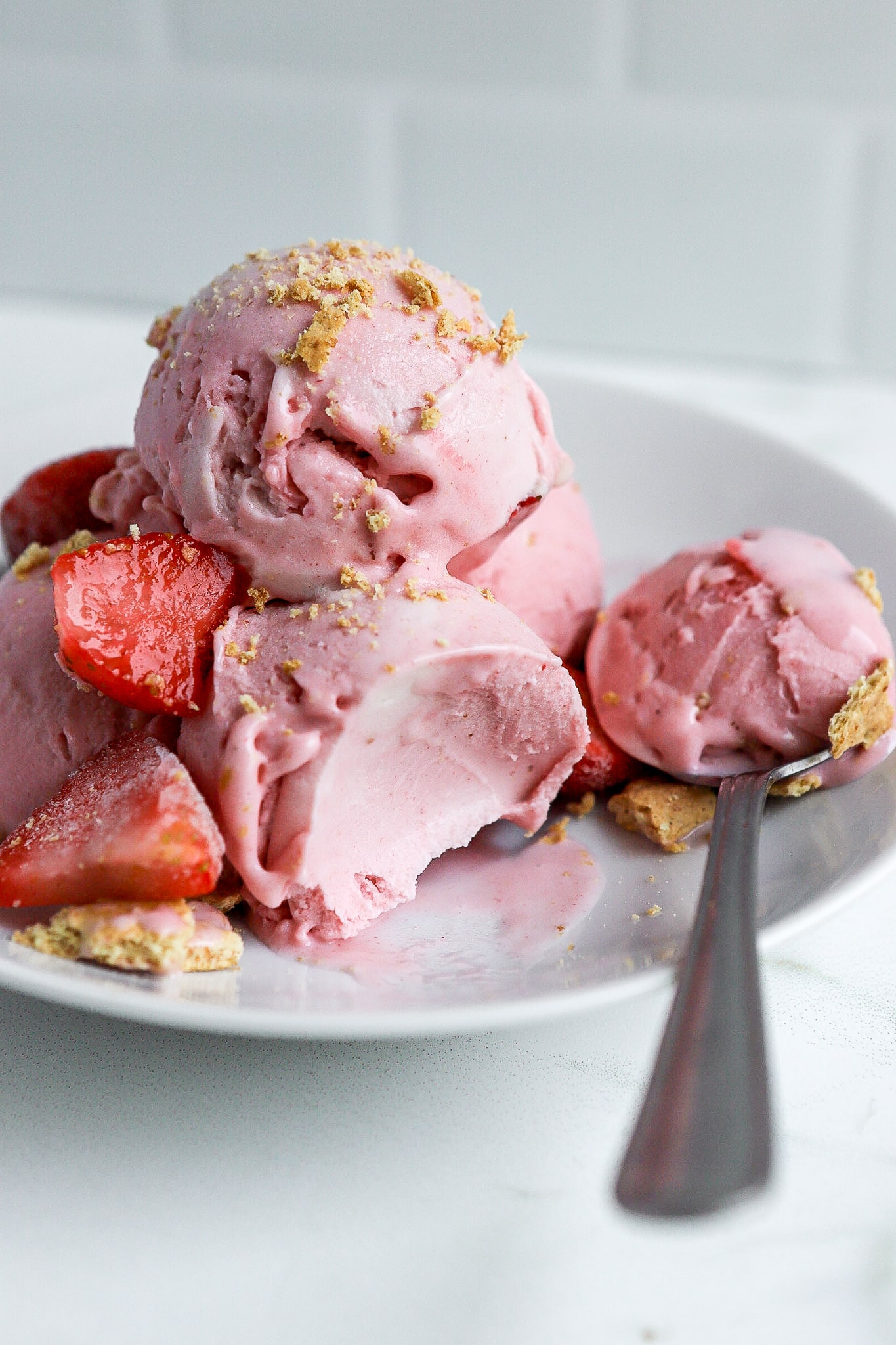 https://basicswithbails.com/wp-content/uploads/2023/07/fresh-strawberries-in-homemade-ice-cream.jpg