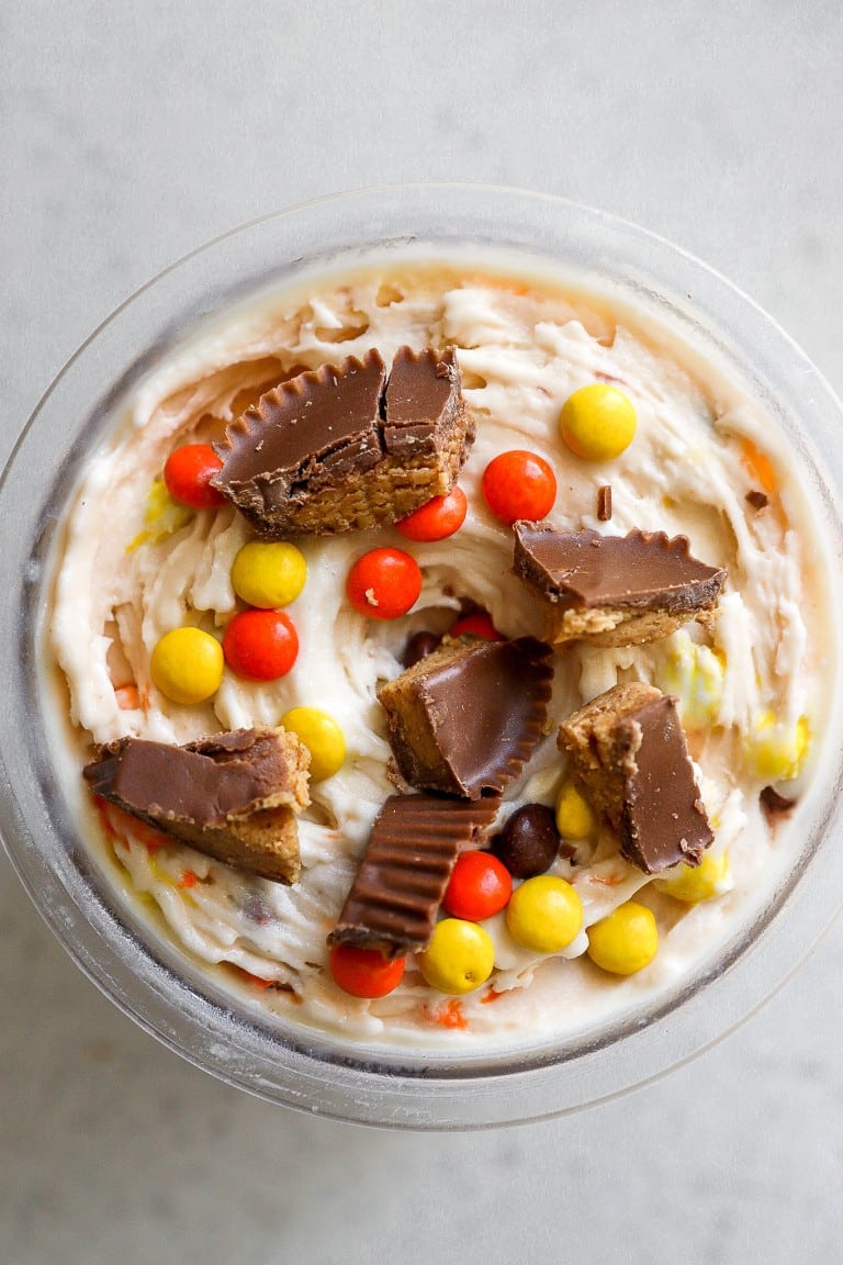 top down view of creamy ice cream recipe with reese's peanut butter cup pieces on top