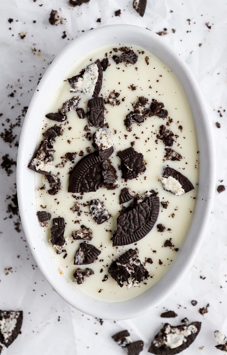 top down view of cookies and cream overnight oats with oreo pieces and white chocolate