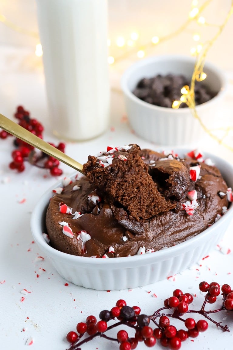 side angle of easy peppermint chocolate baked oats with gold spoon taking a bite