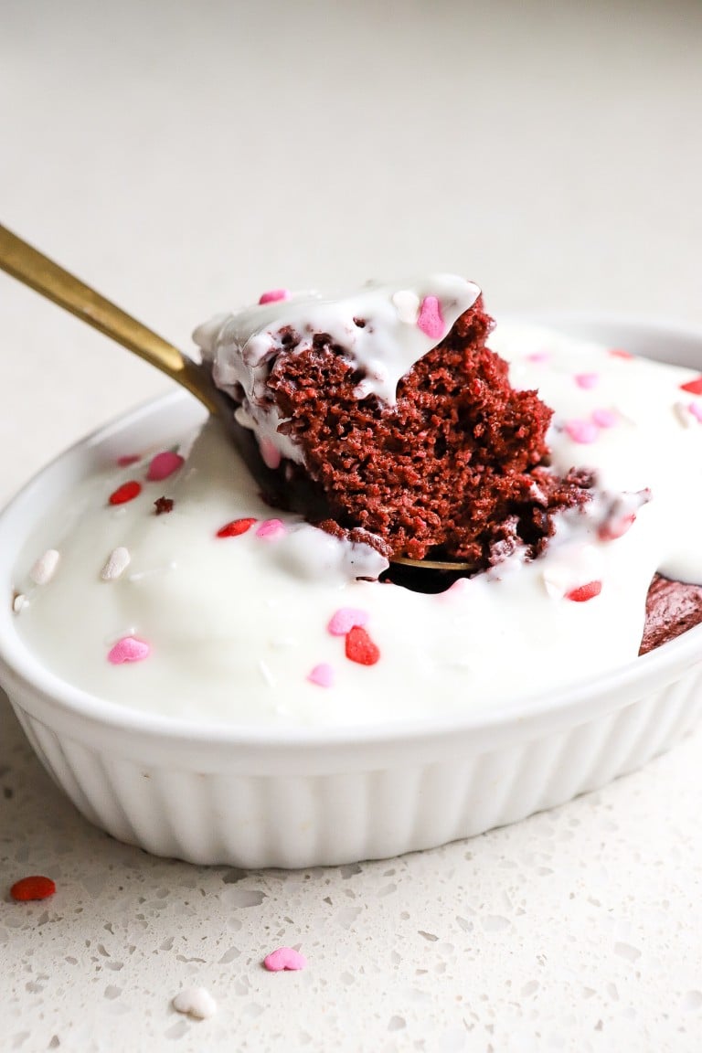 close up shot of red velvet baked oats in white ramekin