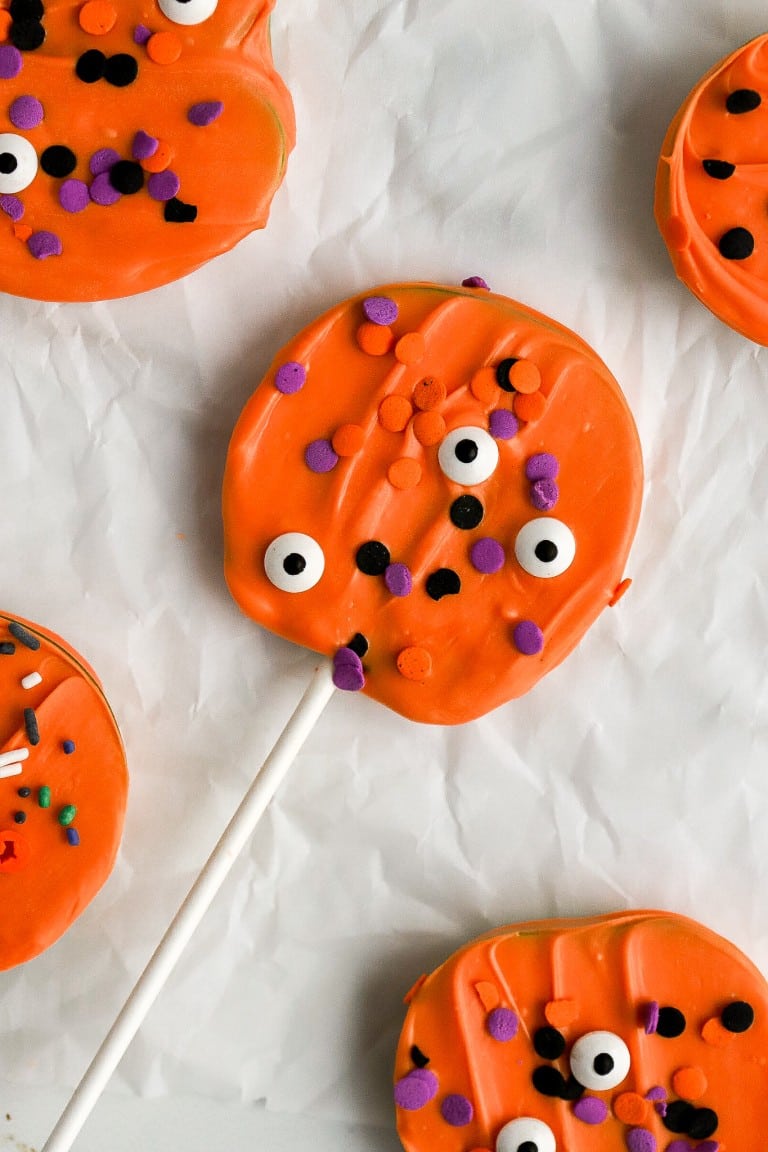 top down view of halloween chocolate covered apples with sprinkles and eyeballs