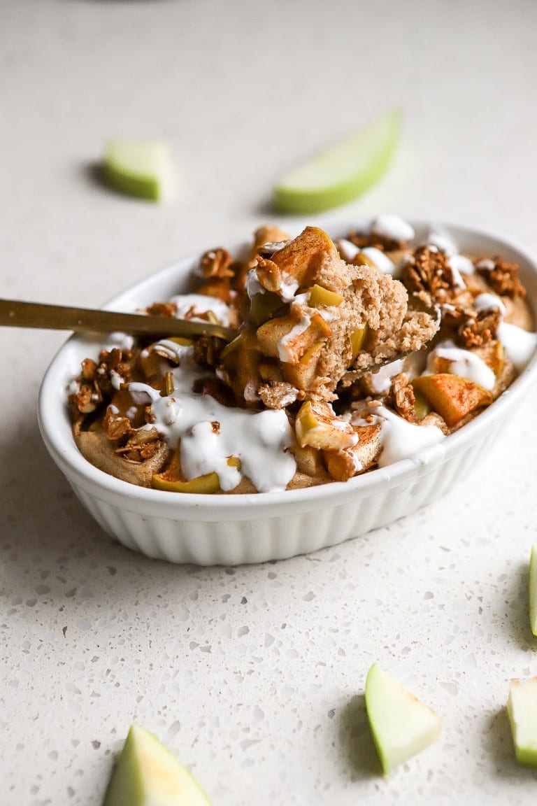 side view of healthy apple oats in white ramekin