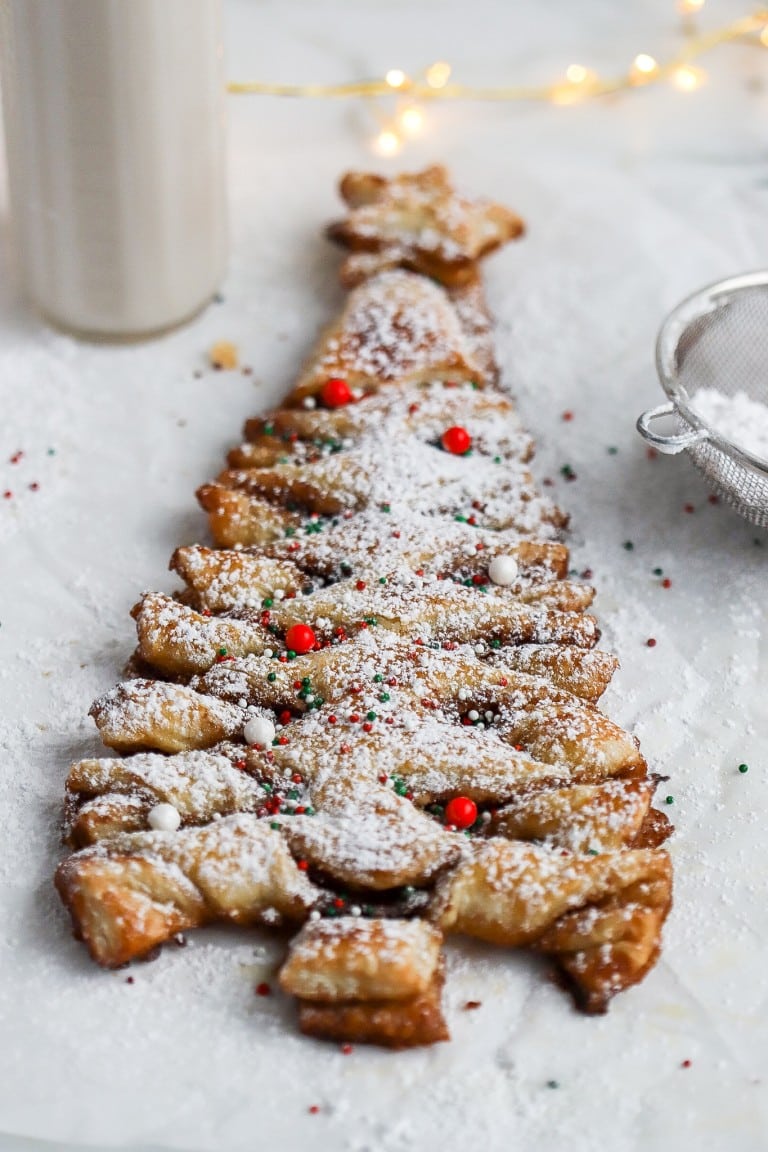 top down view of holiday season cinnamon sugar puff pastry with red candies