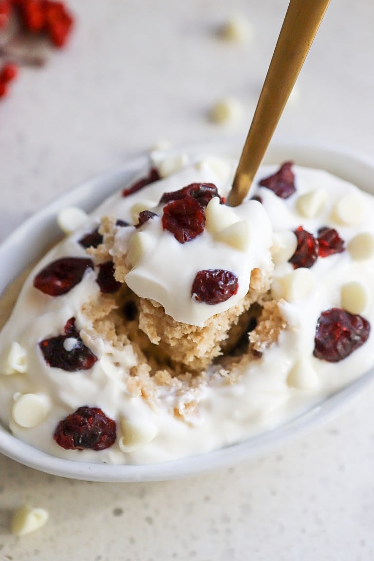 close up of white chocolate cranberry oatmeal bake with dried cranberries and white chocolate chips