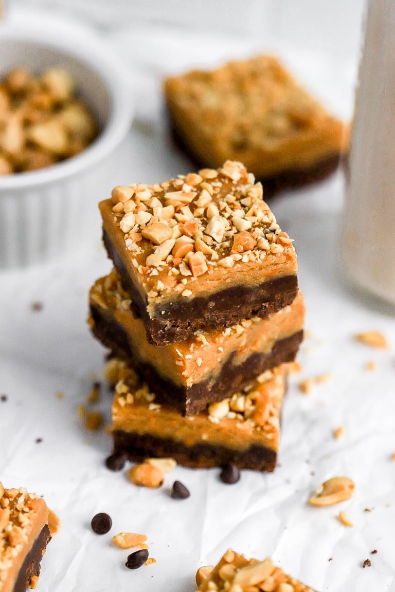 3 pieces of chocolate peanut butter fudge recipe with peanuts on top