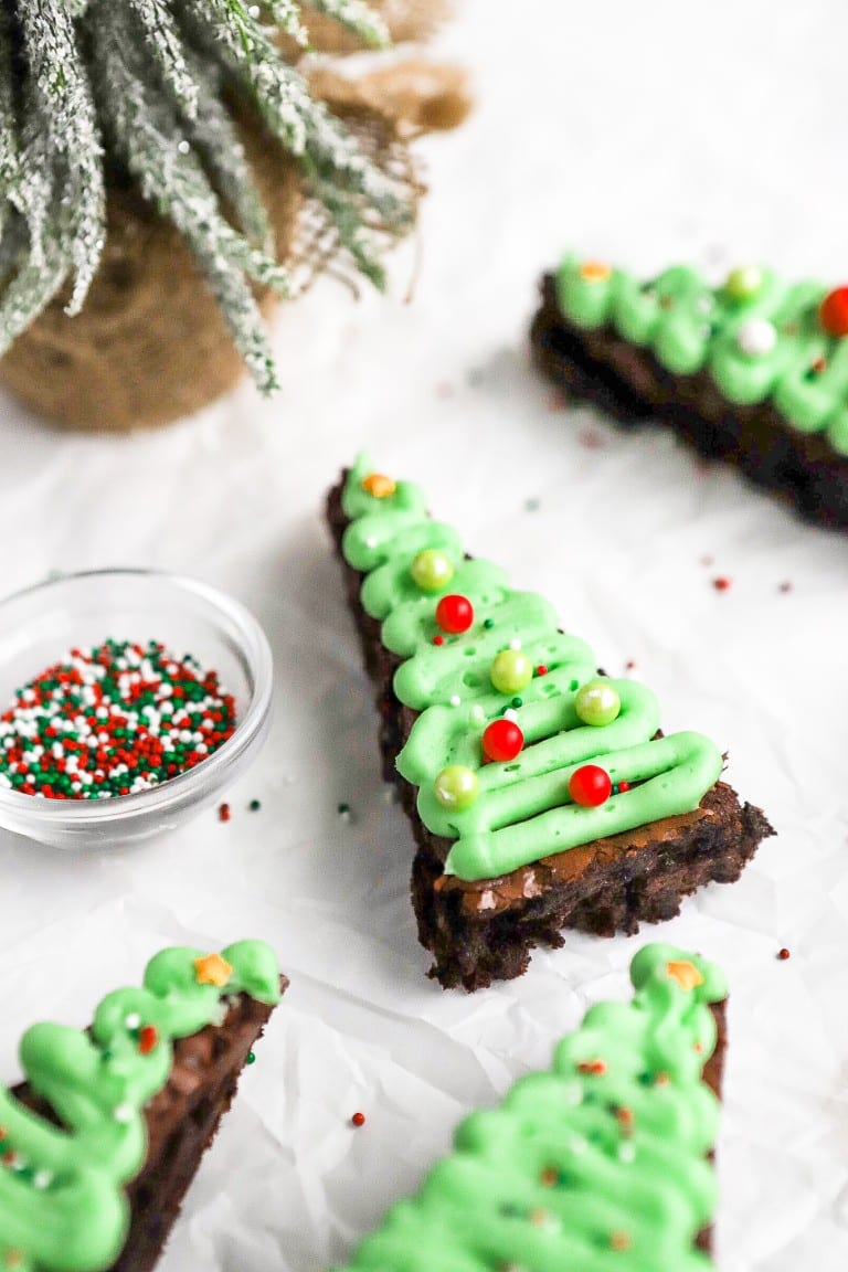 side angle of easy brownie christmas trees with buttercream frosting and sprinkles