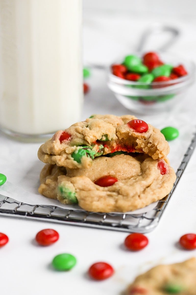 gluten free christmas m&m cookies stacked on top of each other