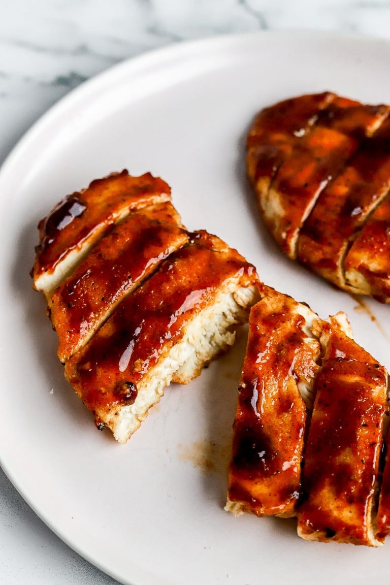 close up view of air fryer bbq chicken recipe on white plate