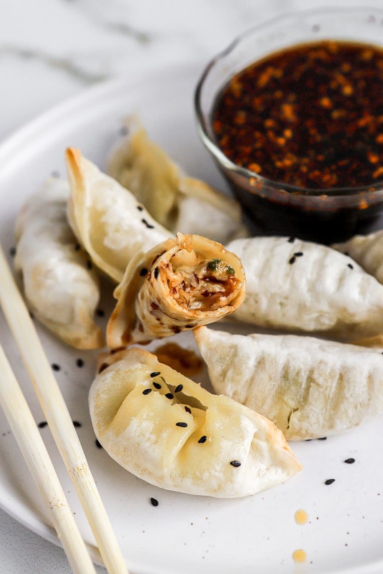 inside of chicken dumplings with soy sauce dipping sauce