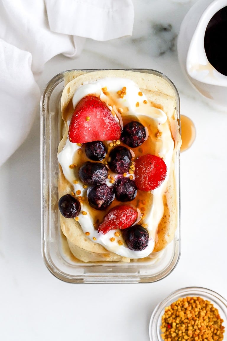 top down shot of a protein pancake bowl with berries on top