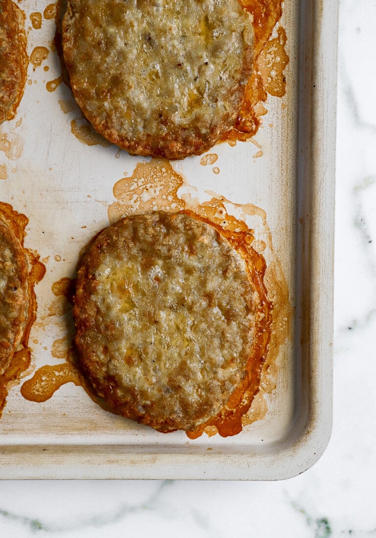 top down view of air fryer breakfast sausages on air fryer tray