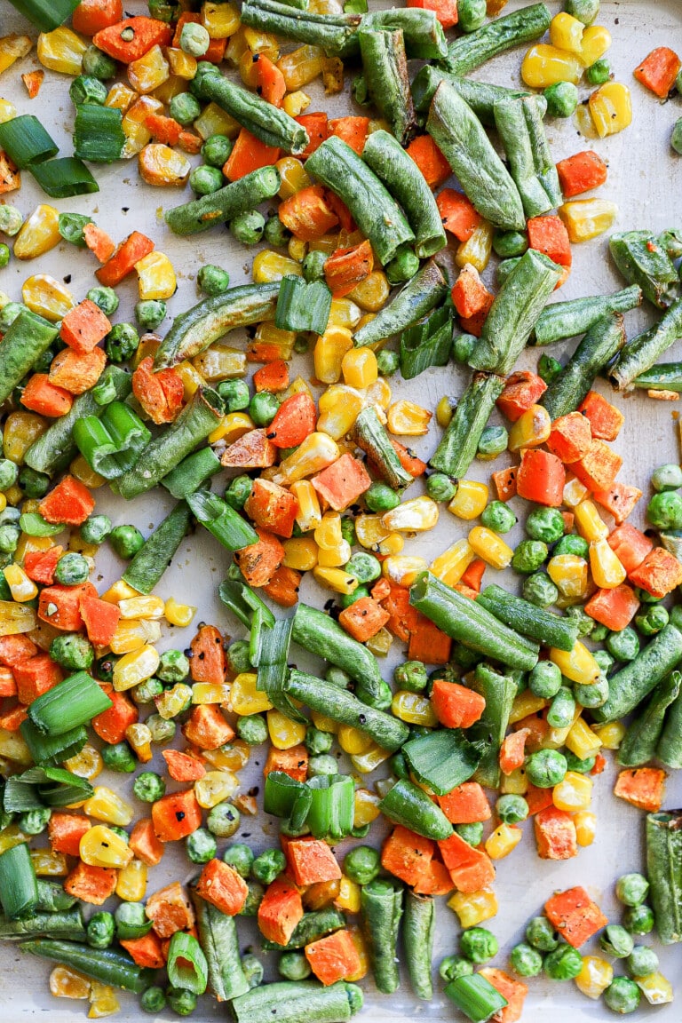 close up shot of frozen vegetables in the air fryer basket