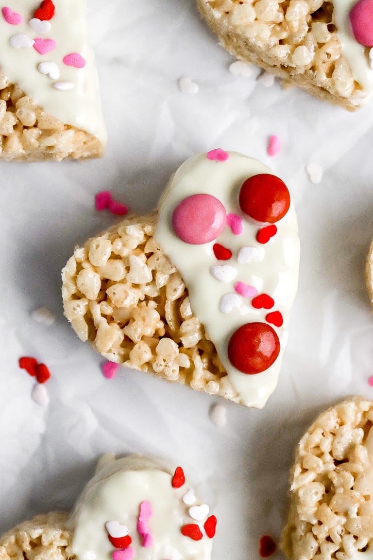 top down view of heart shaped valentines day Rice Krispies with white chocolate and m&m's
