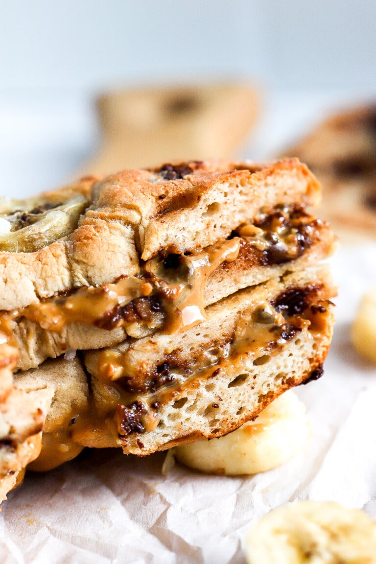 side view of delicious bagels with chocolate chips and peanut butter in the middle