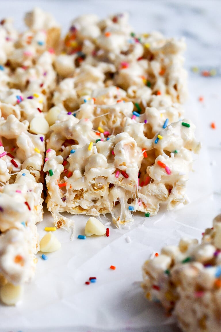 side view of marshmallow Rice Krispie treats on parchment paper