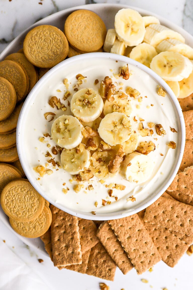 Top down view of easy banana cream pie dip with banana slices and graham crackers.