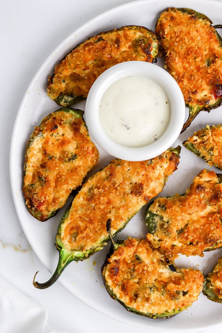 Top down view of easy jalapeno poppers appetizer recipe with panko breadcrumbs on top.