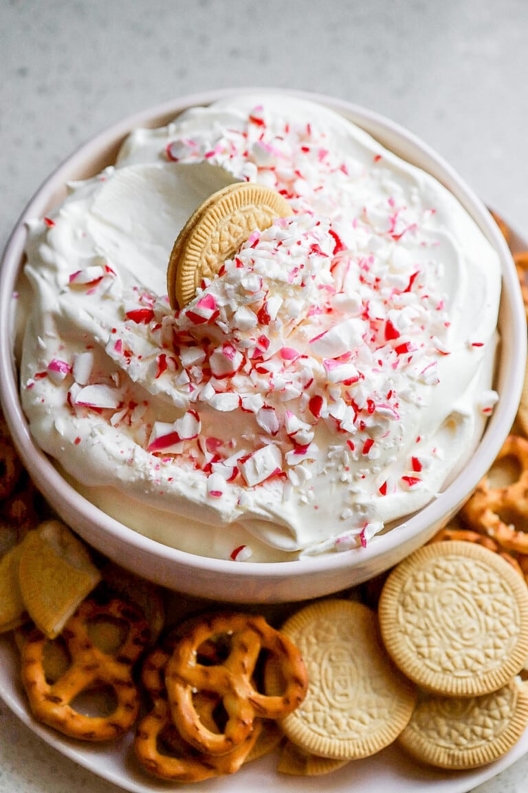 Side angle of holiday dessert dip with crushed candy canes on top.