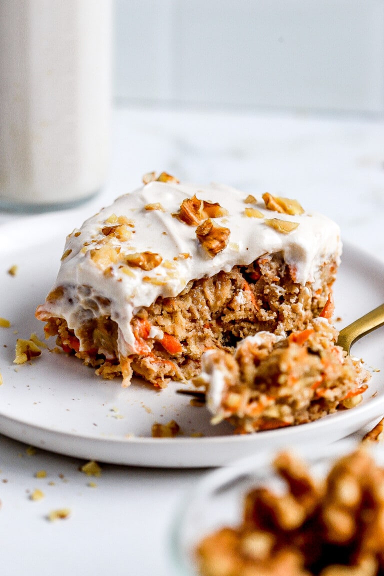 Side angle of carrot cake oatmeal with a maple cream cheese frosting.