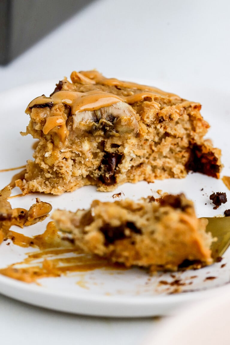 Close up bite shot of chocolate chip banana bread baked oatmeal recipe with gold fork.