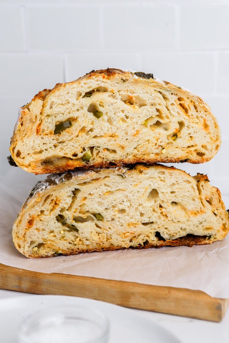 Close up shot of inside of jalapeno cheddar sourdough loaf stacked on top of each other.