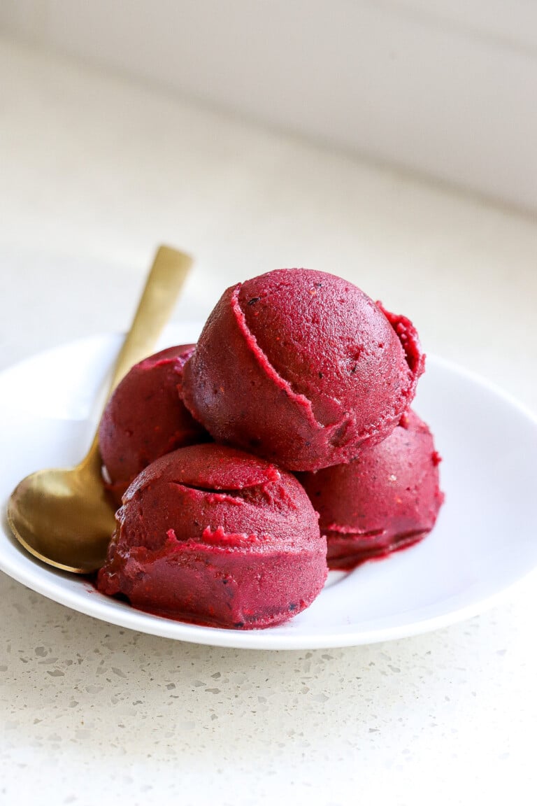 Easy dessert recipe with berries in small white bowl.