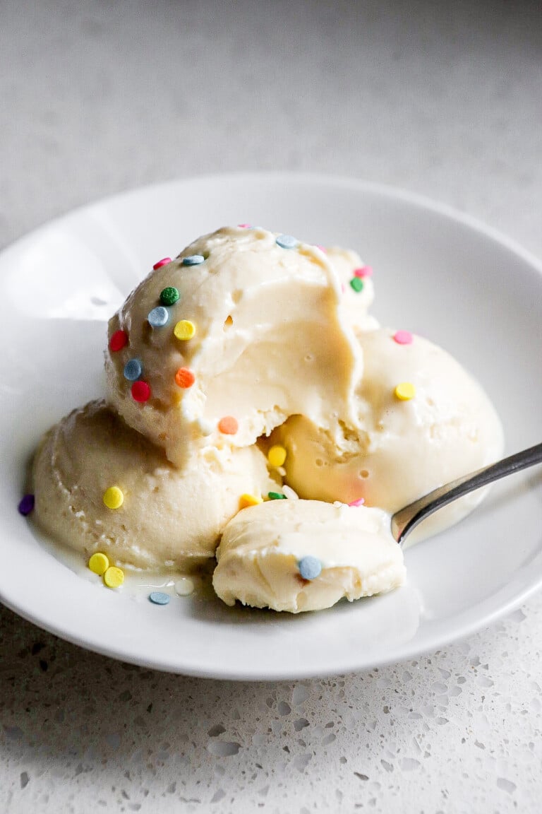 Side angle of high protein frozen yogurt with sprinkles.