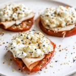 Side angle of tomato cottage cheese sandwich supermodel snack.