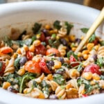 Side angle of easy Mexican street corn pasta salad with tomatoes and fresh cilantro.