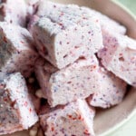 Side view of fluffy protein marshmallows in a white bowl.