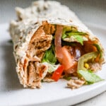 Front facing view of easy homemade doner kebab with fresh veggies and meat inside.