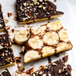 Close up view of peanut butter chocolate banana bark on parchment paper.