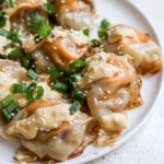 cheeseburger blanket dumplings with big mac sauce drizzled on top and sesame seeds