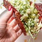 high protein pepperoni pizza caesar wrap with croutons in a human hand