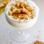 High protein banana cream pie bowl topped with banana and graham crumbs