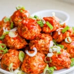 High protein buffalo chicken meatballs tossed in buffalo sauce with ranch