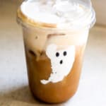 Fluffernutter iced latte in a tall glass topped with marshmallow cold foam